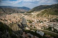 A panoramic shot that captures the landscape of Amasya full of buildings while there is a river flowing through in the