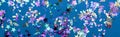 Panoramic shot of colorful confetti on blue party background.