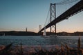 Panoramic shot of the 25 de Abril Bridge located in Lisbon, Portugal during daylight Royalty Free Stock Photo