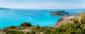 Panoramic shot of Frourio peninsular with cute Assos village surrounded by beautiful blue sea. Kefalonia island, Greece