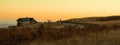 Panoramic shot of a golden sunset over the hill. Royalty Free Stock Photo