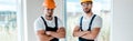 Shot of handsome handymen standing with crossed arms Royalty Free Stock Photo