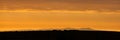 Panoramic shot of the Isle of Man at Sunset from Seascale, Cumbria Royalty Free Stock Photo