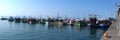 Panoramic shot of Kalk Bay Harbor fishing boats in Cape Town, South Africa. Royalty Free Stock Photo