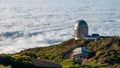 Panoramic shot of the La Palma astronomical observatory on the sea of clouds background Royalty Free Stock Photo