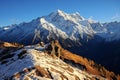 A panoramic shot of a mountain range, with snow-capped peaks disappearing into the distance, symbo