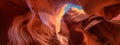 Panoramic shot of multicolored sandstone formations in a Canyon on a sunny day under the blue sky