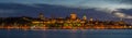 Panoramic shot of the Quebec city with illuminated buildings at a gloomy night