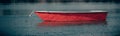 Panoramic shot of a red motorboat in the lake in closeup Royalty Free Stock Photo