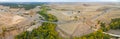 Panoramic shot of road with farm fields in the countryside Royalty Free Stock Photo