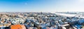 Panoramic shot of roofs of an old town with the tower of Dome Cathedral and House of the Blackheads