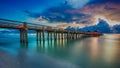 A panoramic shot of a scenic colorful sunset at the beach - Naples Pier, Florida, USA