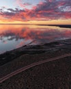 Panoramic shot of smooth sea during sunset on a cloudy day background Royalty Free Stock Photo