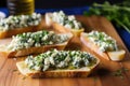 panoramic shot of spread-out blue cheese bruschetta pieces