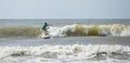 Panoramic shot of talented kid surfing waves on the Atlantic Ocean