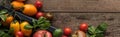 Panoramic shot of tomatoes and spinach in box on wooden table. Royalty Free Stock Photo