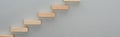 Panoramic shot of wooden blocks symbolizing career ladder isolated on grey with copy space.