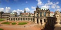 Panoramic shot of the Zwinger palace in Dresden against a blue cloudy sky on a sunny day