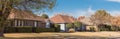 Panoramic single story bungalow houses in suburbs of Dallas with bright fall foliage colors Royalty Free Stock Photo