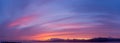 Panoramic sky of a sunset full of clouds