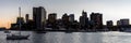 Panoramic skyline of Boston cityscape with its skyscrapers and sailboats at its harbor at sunset Royalty Free Stock Photo