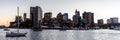 Panoramic skyline of Boston cityscape with its skyscrapers and sailboats at its harbor at sunset Royalty Free Stock Photo