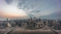 Panoramic skyline of Dubai with business bay and downtown district day to night timelapse.