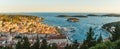 Panoramic skyline view of the old town of Hvar with turquoise water bay with yachts and islands in Dalmatia, Croatia Royalty Free Stock Photo