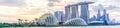 Panoramic skyscrapers from Singapore business district along Marina Bay East river at sunset Royalty Free Stock Photo