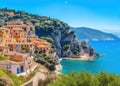 Panoramic of a small and colorful Mediterranean coastal village between the sea and the mountains
