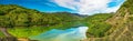 Panoramic spring view with clear mountains lake Royalty Free Stock Photo