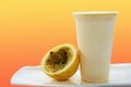 Panoramic still life of colorful frozen fruit granita drinks flowing in plastic takeaway cups with ice cream straws