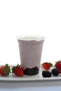 Panoramic still life of colorful frozen fruit granita drinks flowing in plastic takeaway cups with ice cream straws