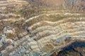 Panoramic of stone quarry with open pit mine in mountain Royalty Free Stock Photo
