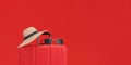 Panoramic of Suitcase with sun glasses and hat on red background. Exotic Vacation concept Royalty Free Stock Photo