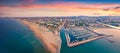 Panoramic summer view from flying drone of Libera Rimini public beach. Royalty Free Stock Photo