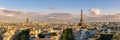 Panoramic summer view of Paris rooftops at sunset with the Eiffel Tower