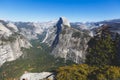 Panoramic summer view of Yosemite valley with Half Dome mountain, Tenaya Canyon, Liberty Cap, Vernal Fall and Nevada Fall, seen Royalty Free Stock Photo