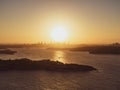 Panoramic sunset aerial drone view of famous Sydney Harbour with the CBD city centre skyline in the background. South Head Royalty Free Stock Photo