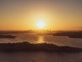 Panoramic sunset aerial drone view of famous Sydney Harbour with the CBD city centre skyline in the background. South Head Royalty Free Stock Photo