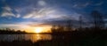 Panoramic Sunset by Lakeside with Swans