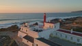 Panoramic sunset seascape lighthouse standing rocky seashore aerial view. Royalty Free Stock Photo