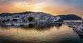 Panoramic sunset view of the city and harbour of Skopelos island,