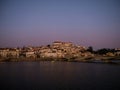 Panoramic sunset view of Coimbra old historical center on hill and Ponte de Santa Clara bridge river Mondego Portugal Royalty Free Stock Photo