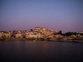 Panoramic sunset view of Coimbra old historical center on hill and Ponte de Santa Clara bridge river Mondego Portugal Royalty Free Stock Photo