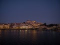 Panoramic sunset view of Coimbra old historical center on hill and Ponte de Santa Clara bridge river Mondego Portugal Royalty Free Stock Photo