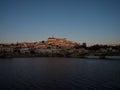 Panoramic sunset view of Coimbra old historical center on hill and Ponte de Santa Clara bridge river Mondego Portugal Royalty Free Stock Photo