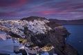 Panoramic sunset view of the illuminated village Oia Royalty Free Stock Photo