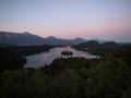 Panoramic sunset view Lake Bled Island Blejsko jezero from Osojnica viewpoint hill Julian alps mountains Slovenia Europe