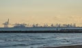 panoramic sunset view port in the harbor cranes transport From the beach Royalty Free Stock Photo